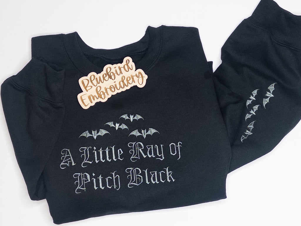 A Little Ray of Pitch Black Embroidered Crewneck w/ sleeve detail