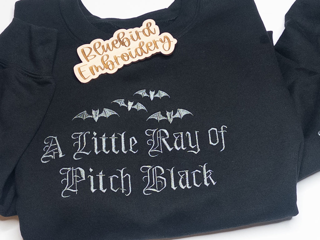 A Little Ray of Pitch Black Embroidered Crewneck w/ sleeve detail